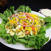 Country Fixin Salad · Iceberg and romaine lettuce with diced tomatoes, eggs, ham, turkey, shredded cheese, green p...