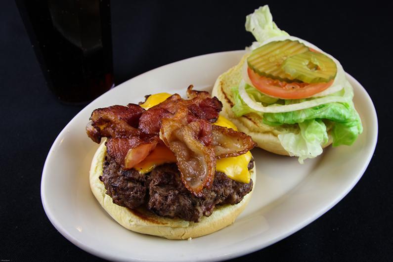 Granny's Grandburger Sandwich Only · A mouth-watering 1/2 lb. of ground beef. Served on a bun with lettuce, tomato, onion, and pickle chips.