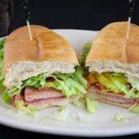 Super San Sandwich Only · Salami, ham, provolone cheese, lettuce, tomato, onion, and hot peppers. Served on a fresh su...