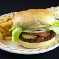 Breaded Pork Tenderloin Platter · Golden brown with lettuce, tomato, onion, and pickles. Served with french fries and creamy c...