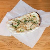 51. Garlic Naan · Whole white bread topped with fresh garlic.