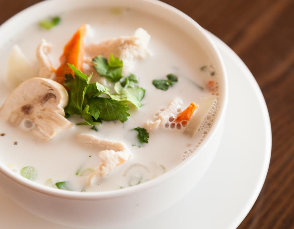 Tom Kha · Coconut milk with mushroom, onion, carrot and Thai spice. Your choice of chicken or vegetables.