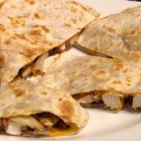 Chicken Quesadilla · Stuffed with grilled chicken, bacon, cheese and green onion, served with sour cream and salsa.