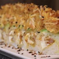 Skinny Roll · Shrimp tempura, kanikama, fish tempura, avocado, cream cheese, soy paper, topped with our te...