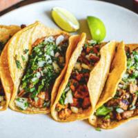 Al Pastor Taco · Onion and cilantro