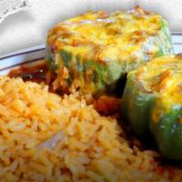 Texas Bell Pepper · 2 bell peppers stuffed with seasoned ground beef, topped with Spanish sauce, melted American...