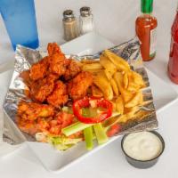 9 Buffalo Wings with French Fries · Cooked wing of a chicken coated in sauce or seasoning.
