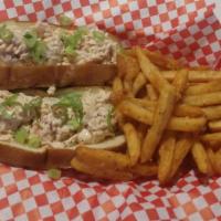Twin Lobster Rolls · Succulent and sweet lobster meat with celery,green onion, a touchof Cajun and mayo and pickl...