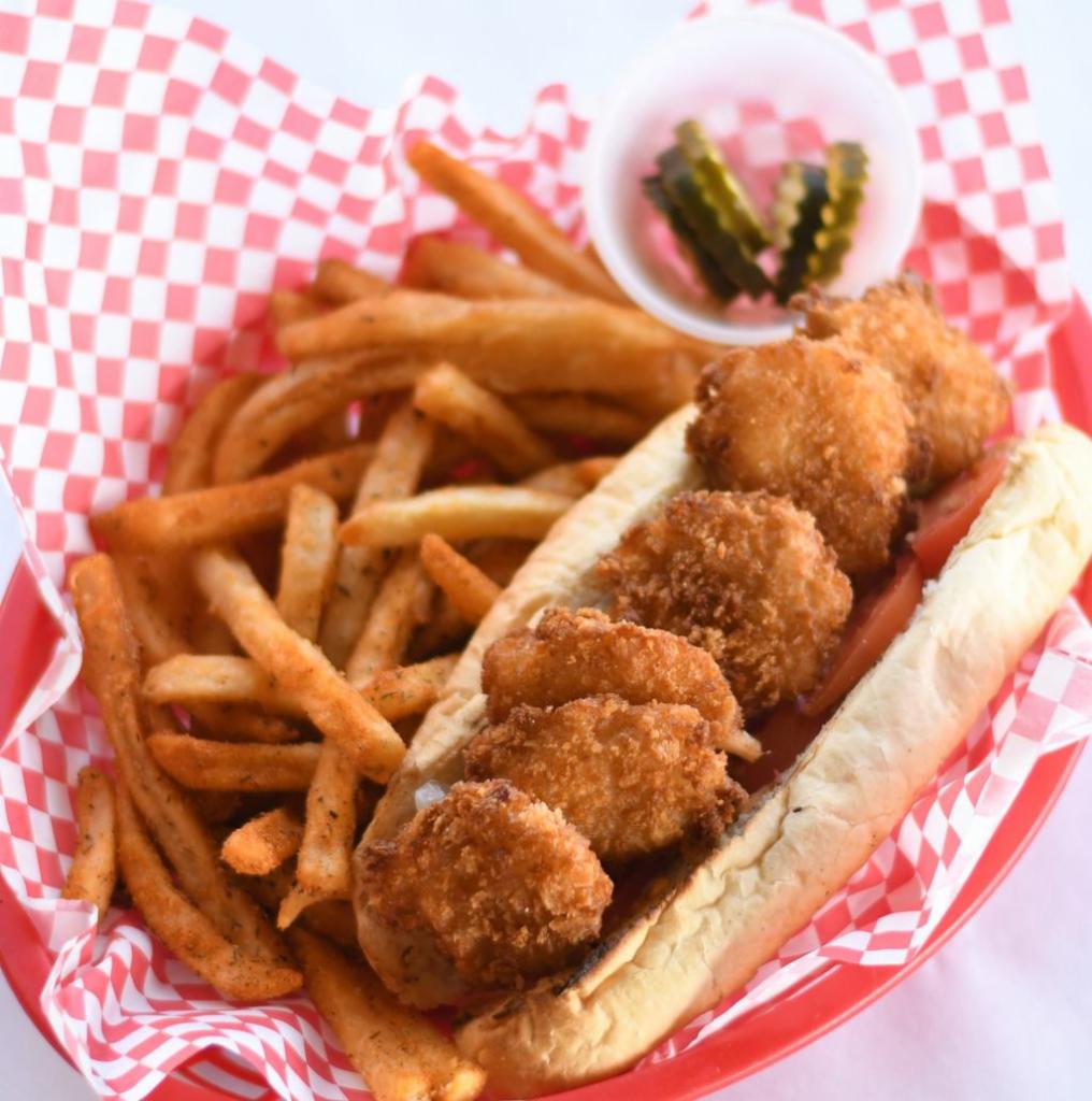 Breaded Shrimp Po Boy · Lightly fried breaded shrimp served with lettuce, tomato, pickle, and Cajun Mayo on a toasted baguette.