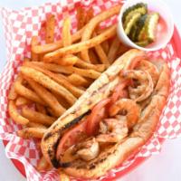 Grilled Shrimp Po Boy · Garlic butter grilled shrimp served with lettuce, tomato, pickle, and Cajun Mayo on a toaste...