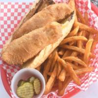 Beer Battered Whitefish Po Boy · Beer Battered white fish fried and served with lettuce, tomato, pickle, and Cajun Mayo on a ...