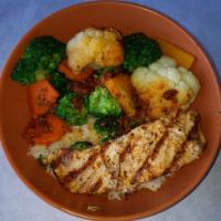 Grilled Salmon · Salmon fillet grilled with garlic butter and vegetables over rice or linguine.