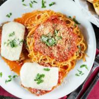 Chicken Parmigiana · Seasoned and breaded chicken breast baked with marinara sauce, topped with mozzarella and Pa...