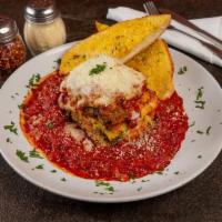 Vegetarian Lasagna · A combination of ricotta cheese, mozzarella, sauteed vegetables and marinated spinach layere...