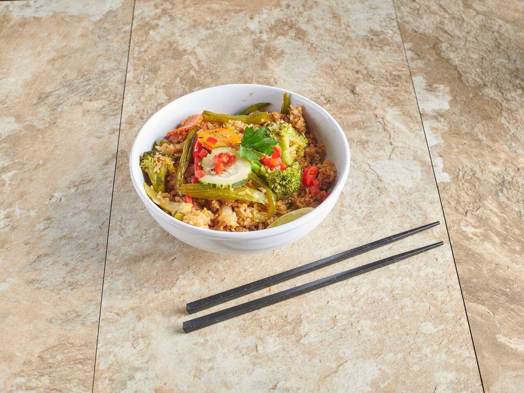 V20. Basil Fried Rice · Come with bell pepper, onions, pepper, string beans, egg and basil leaves. Your choice vegetarian meat. Hot and spicy. Vegetarian.