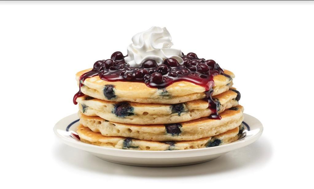 Double Blueberry Pancakes · Double the blueberries, double the taste! Four fluffy buttermilk pancakes filled with blueberries & topped with blueberry compote.