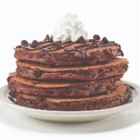 Chocolate Chocolate Chip Pancakes · We think chocolate is perfect any time of day. Four fluffy chocolate pancakes filled with ch...