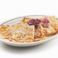 Swedish Crepes · Four delicate crepes topped with sweet-tart lingonberries & lingonberry butter.

