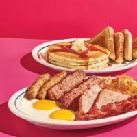 Big Farmhouse BreakFEAST · Get four types of meat, including 2 smoked sausage links, 2 strips of hickory-smoked bacon, ...