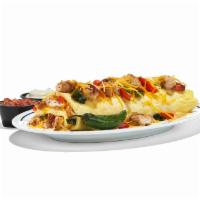 Chicken Fajita Omelette · The perfect fiesta in one package. Our omelette stuffed with grilled chicken breast with Pob...