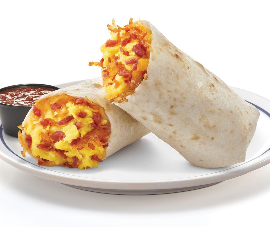 The Classic Burrito & Bowl · A true breakfast classic with scrambled eggs+, choice of hickory-smoked bacon pieces or diced sausage, shredded Jack & Cheddar cheese and hash browns all wrapped up in a warm flour tortilla or scrambled in a bowl. Served with our salsa and choice of side.