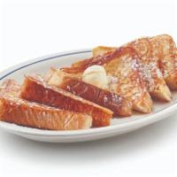 Our Original French Toast · Six triangles of thick-cut French toast topped with whipped real butter & dusted with powder...