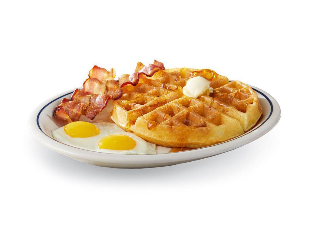Belgian Waffle Combo · Our house-made golden-brown Belgian waffle is served with 2 eggs* your way and 2 custom-cured hickory-smoked bacon strips or 2 pork sausage links.

