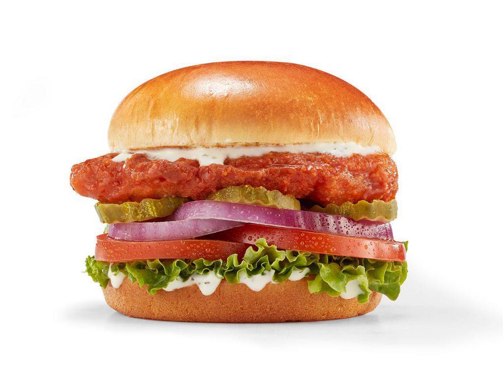 Spicy Buffalo Chicken Sandwich · Buttermilk crispy chicken breast made with all-natural chicken, tossed in Frank’s RedHot® Buffalo sauce, lettuce, tomato, red onion, pickles & buttermilk ranch on a Brioche bun.

