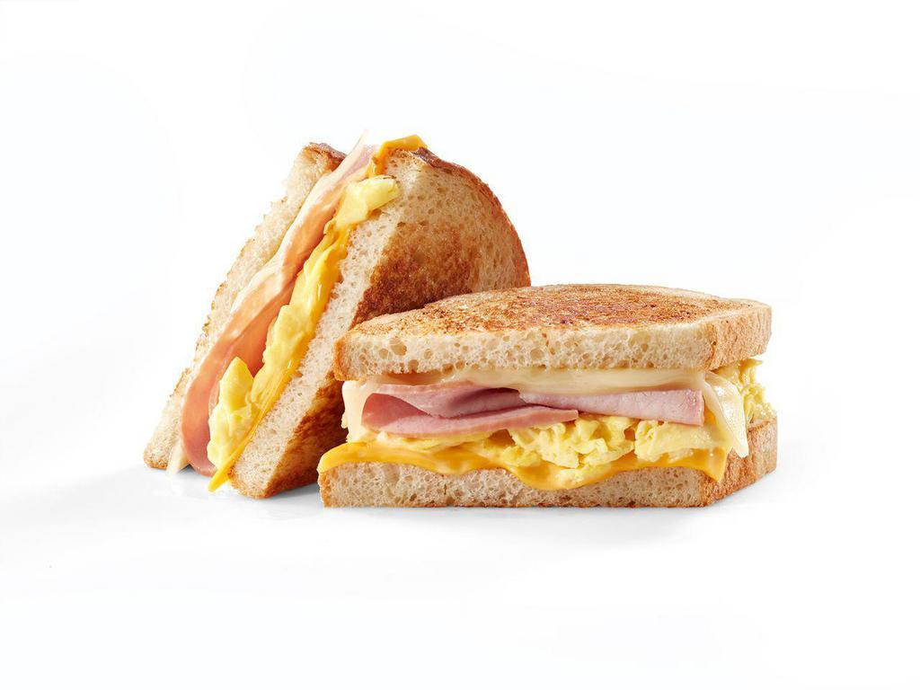Ham & Egg Melt · Grilled artisan sourdough filled with scrambled eggs, sliced ham, Swiss & American cheeses.


