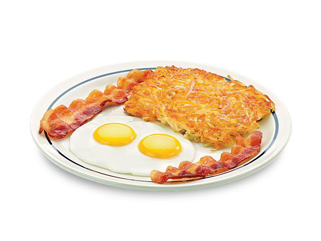 55+ Rise 'N Shine · Two eggs* your way, hash browns, 2 bacon strips or 2 pork sausage links & toast.

