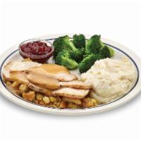 55+ Roasted Turkey Dinner · Carved roasted turkey breast topped with turkey gravy.

