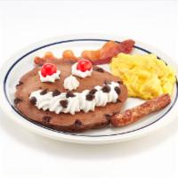  Funny Face® Pancake Combo · A chocolate chip pancake topped with whipped topping & chocolate chip smile and maraschino c...