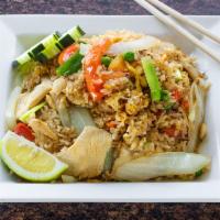 51. Thai Fried Rice · Thai style fried rice with garlic, onion, tomato, peas, carrots and egg with choice of chick...