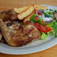 Oven-Roasted Chicken · Served with Greek-style potato wedges.