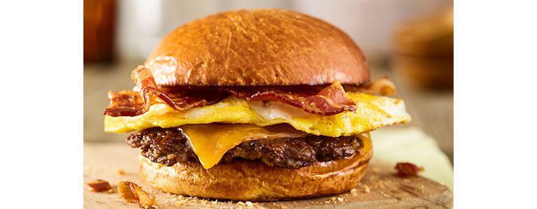 Breakfast Burger · Certified Angus Beef, freshly cracked eggs, applewood smoked bacon, aged cheddar cheese, toasted brioche bun