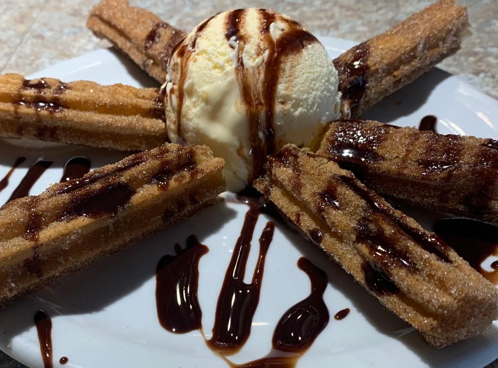 Churros · Churro sticks with cinnamon , sugar and chocolate syrup ice cream only if added in the option 