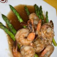 31. Shrimp Asparagus · Sauteed shrimps in light garlic sauce on a bed of steamed asparagus.