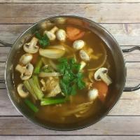 11. Tom Yum Soup · Thai style hot and sour soup with mushrooms, onion, tomatoes and lemon grass with choice of ...