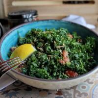Kaleboulleh Salad Bowl · Kale, parsley, red onion, tomato and puffed wheat, served with lemon vinaigrette.