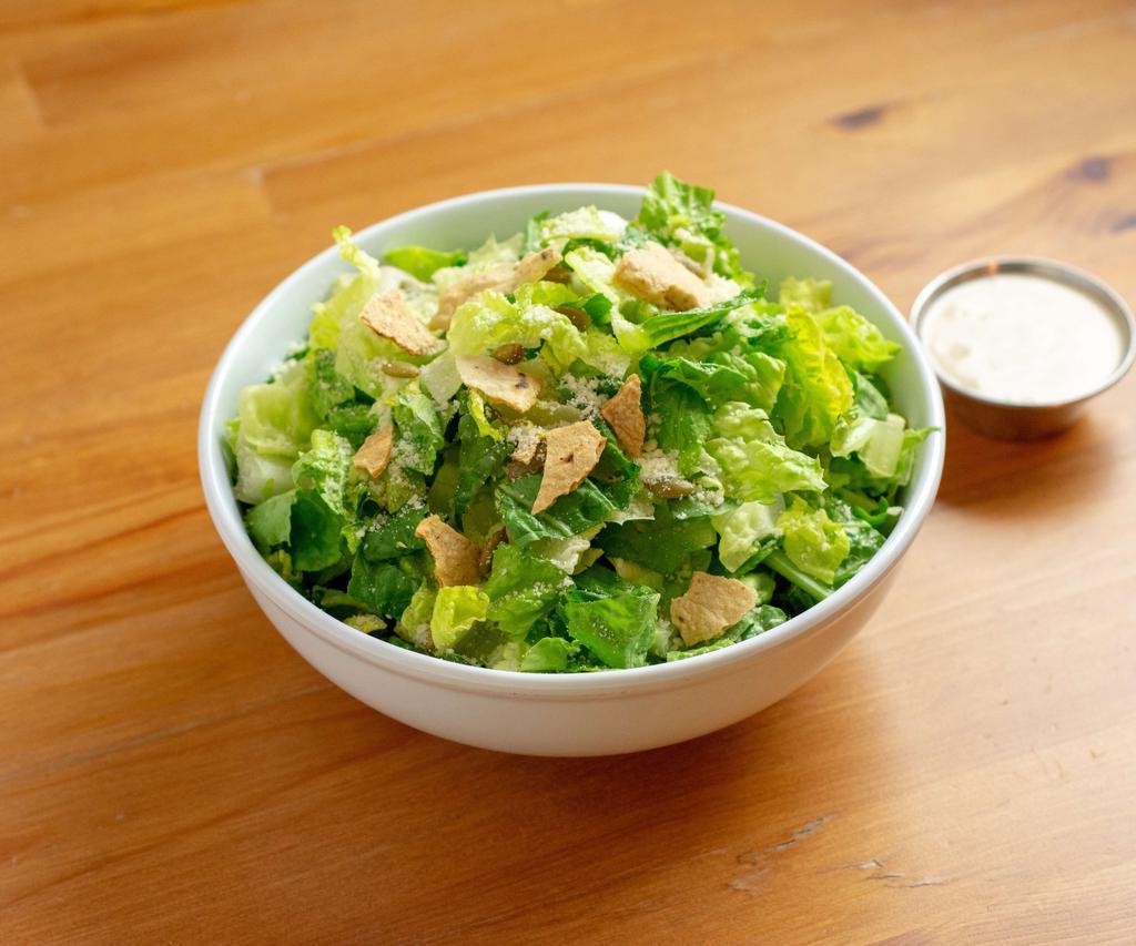 Caesar Salad · Romaine lettuce, baby kale, toasted pepitas, Cotija cheese and herb croutons.