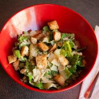 Caesar Salad (Full Size) · Romaine lettuce tossed with Caesar dressing and topped with shaved Parmesan and house made c...