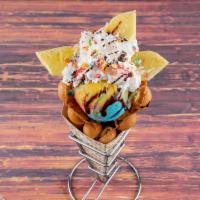 6. Pineapple Colada Ice Cream Waffle · Bubble waffle, choice of ice cream, fresh pineapple, whipping cream, coconut flakes & chocol...