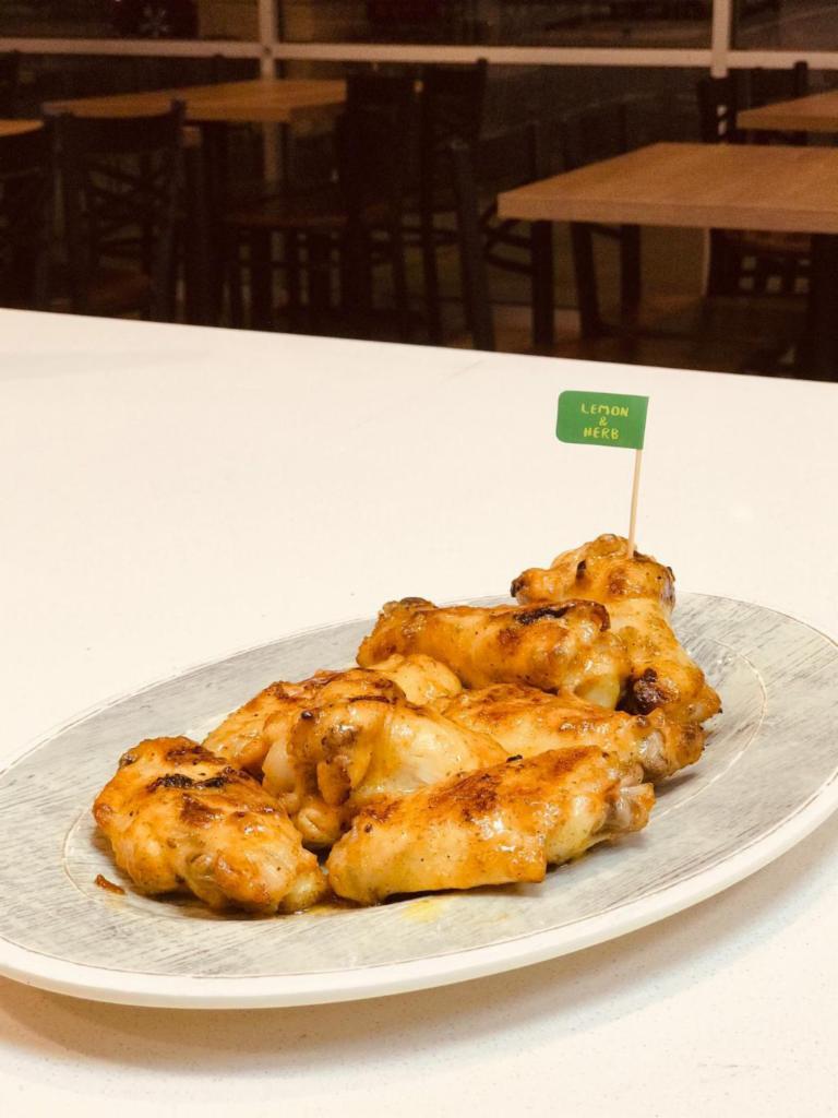 10 Wings · All natural, hormone free, and grass fed. Wings are marinated  for 24 hours before being slow cooked over an open flame grill in our famous Peri Peri sauces. 