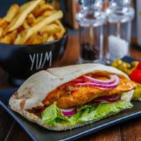Chicken Pita · Shredded chicken served in a pocket pita with salad, tomatoes, onions, and mayo. 