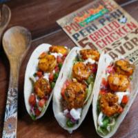 Shrimp Tacos (3 pcs) · Tender pieces of shrimp cooked in Peri Peri sauces. Served on salad, salsa, and sour cream. 