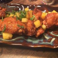 Sweet Devil Wings · Fire-grilled chicken wings, pineapple-habanero glaze, and cilantro ranch.
