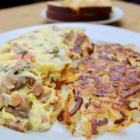 Famous Omelette · Onions, tomato, ham, and cheese.