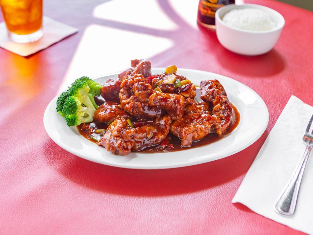 General Tso's Chicken · Pieces of crispy chicken served in a spicy sauce of seared red peppers and onions. Spicy.