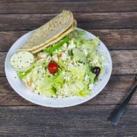 Greek Salad · Lettuce, tomatoes, green peppers, carrots, Greek olives, cucumbers and feta.