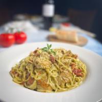 9 Muses Pasta · Spaghetti tossed in a light Basil pesto cream sauce sautéed with , garlic, chicken, and sun ...